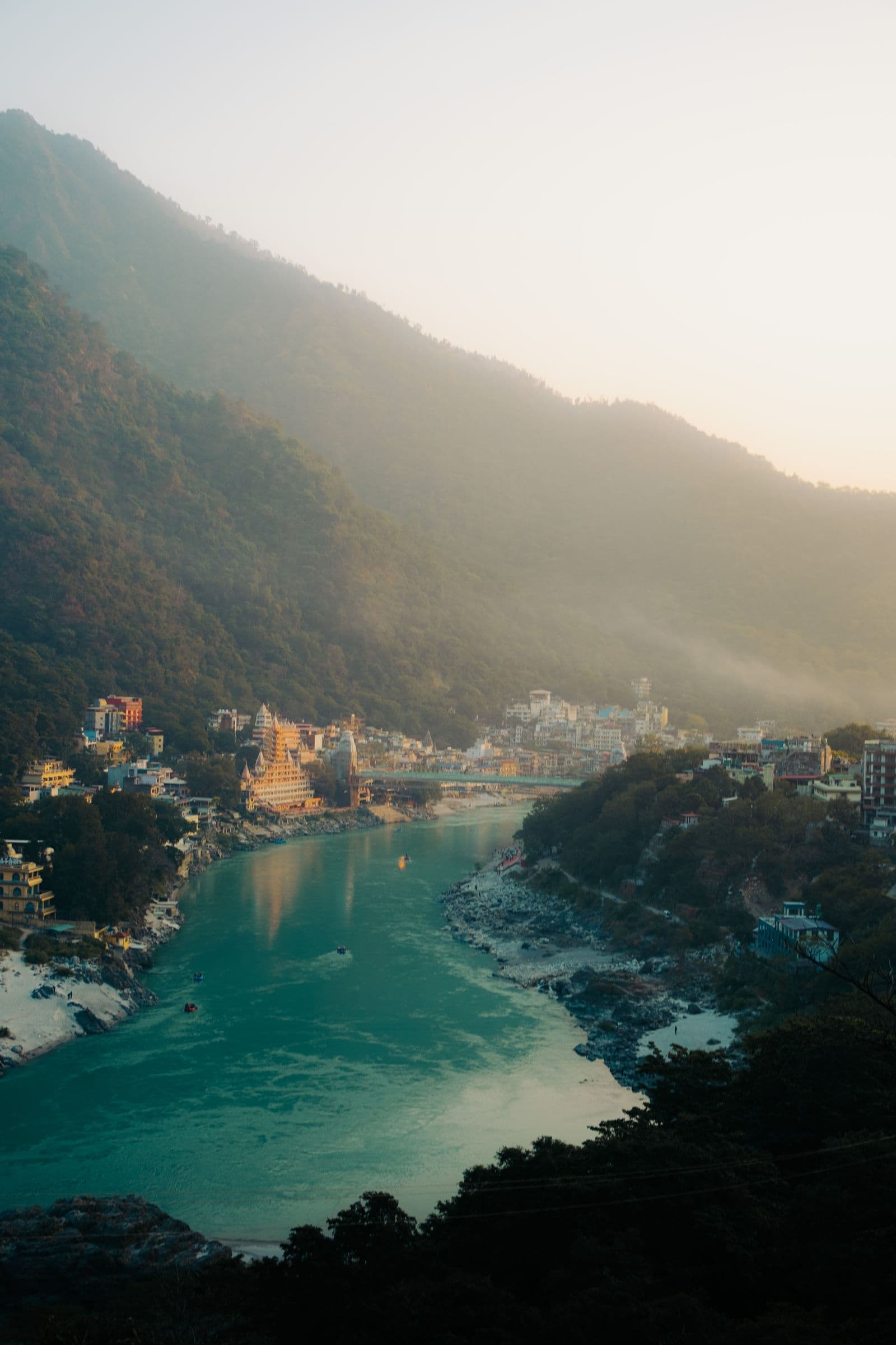 The Ganges River winding through the mountain valley at Rishikesh.